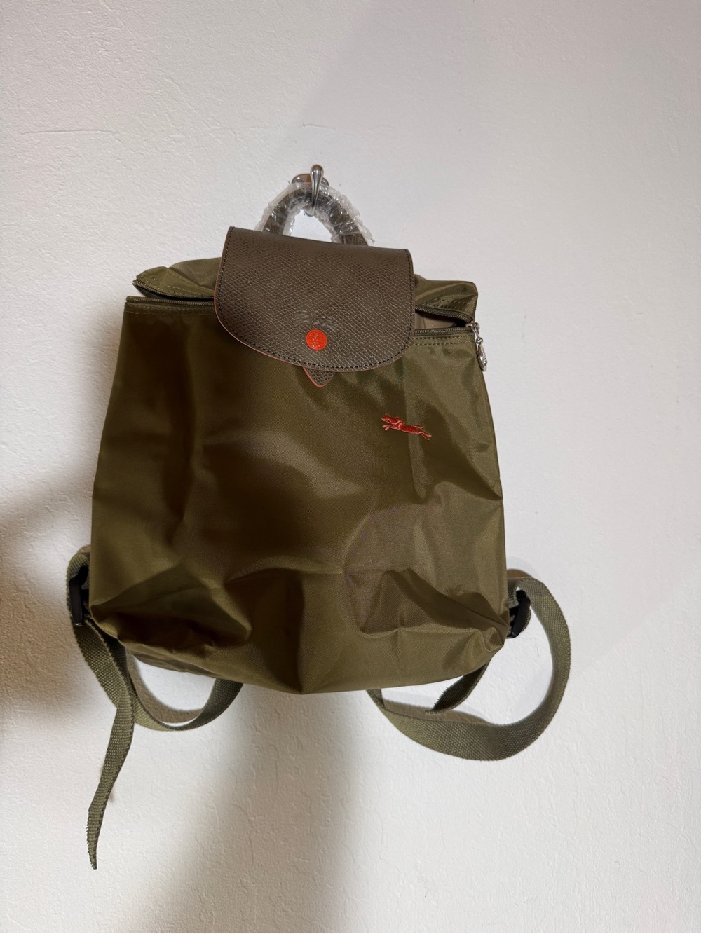 Longchamp Olive Green Nylon Le Pliage Backpack with Brown Flap and Orange Button